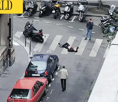  ?? WLADIA DRUMMOND VIA THE ASSOCIATED PRESS ?? A man lays on a street in central Paris Saturday after a stabbing rampage by a 20-year-old Chechen-born man, who was fatally shot by police. The killer was on a police watchlist for radicalism but had a clean criminal record.