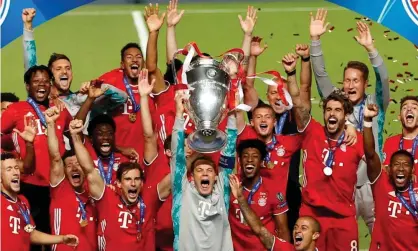  ??  ?? Bayern Munich lift the 2020 Champions League trophy. Photograph: Matthew Childs/Reuters