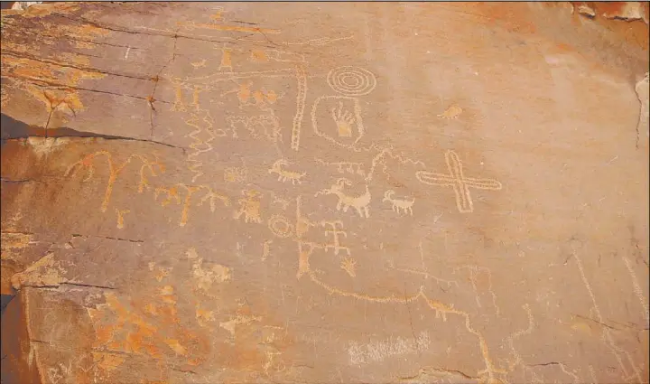  ?? Deborah Wall Las Vegas Review-Journal ?? Pictograph­s and petroglyph­s found in our region, like these ones at Atlatl Rock in Valley of Fire State Park, are irreplacea­ble cultural treasures.