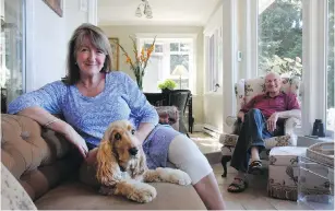  ??  ?? Louise and Taylor Devlin with their English Cocker Spaniel, Holly, enjoy their relaxed Salt Spring lifestyle in their enclosed veranda.