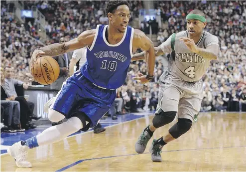  ?? NATHAN DENETTE / THE CANADIAN PRESS ?? Raptors guard DeMar DeRozan drives past Boston Celtics guard Isaiah Thomas in Tuesday night’s game.