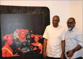  ??  ?? Vice Chairman, Exxon Mobil, Udom Inoyo with artist Wilfred Ukpong at the latter's exhibition at the Mike Adenuga Centre , Alliance Francaise in Ikoyi, Lagos .... recently