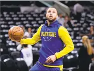  ?? Eric Gay / Associated Press ?? Golden State Warriors guard Stephen Curry warms up before Game 3 of the team's first-round playoff series against San Antonio.