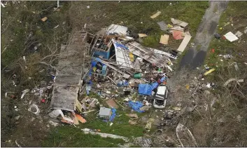  ?? MATT SLOCUM — THE ASSOCIATED PRESS ?? In this aerial photo, the remains of destroyed homes are seen in the aftermath of Hurricane Ida, Sept. 6in Lafitte, La.