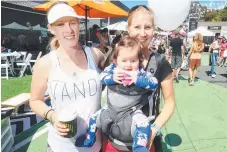  ??  ?? Jodie Holdsworth (left) and Alyssia Berghammer with eight-month-old Ilaria joined those enjoying the festival.