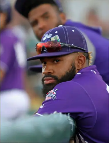  ?? RANDY MEYERS — FOR THE MORNING JOURNAL ?? Logan Farrar of the Crushers looks on from the dugout during a game against Schaumburg on Aug. 23.