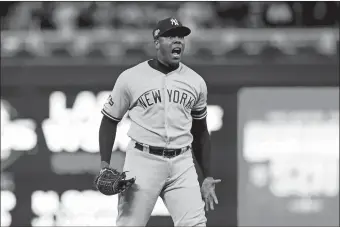  ?? JIM MONE/AP PHOTO ?? New York Yankees relief pitcher Aroldis Chapman celebrates after his team’s 5-1 victory over the Minnesota Twins in Game 3 of an American League Division Series on Monday at Minneapoli­s.