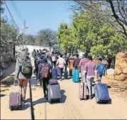  ??  ?? Wuhan evacuees leave the quarantine facility at Manesar on February 8.
ANI