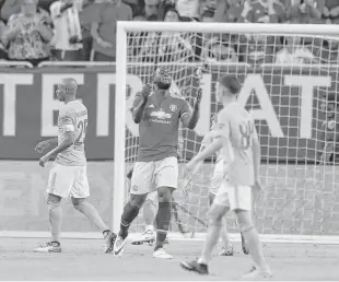  ?? Karen Warren / Houston Chronicle ?? Manchester United forward Romelu Lukaku, center, missed this attempt to score, but he did net the first — and winning — goal in a 2-0 victory over Manchester City on Thursday night at NRG Stadium. The match marked the first time the Premier League foes...