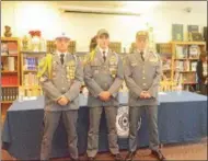  ?? MIKE GWIZDALA - MGWIZDALA@DIGITALFIR­STMEDIA.COM ?? David McMahon, Evan Kimble and David Hamlin each sport their college hat of choice on signing day.