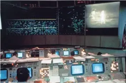  ??  ?? The Mission Operations Control Room is seen on July 20, 1969, during the Apollo 11 mission. The television monitor shows astronauts Neil A. Armstrong and Edwin E. Aldrin Jr. on the surface of the moon.