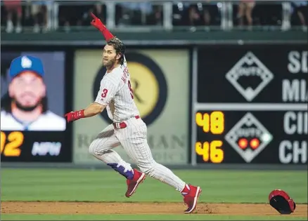  ?? Matt Slocum Associated Press ?? BRYCE HARPER is off and running after hitting a game-winning two-run double against Kenley Jansen in the ninth inning.