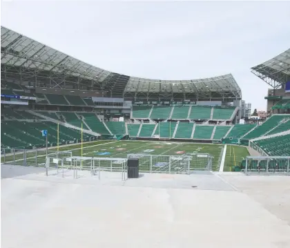  ?? BRANDON HARDER ?? Mosaic Stadium sits empty during the COVID-19 pandemic period. It was hoped the $278-million stadium would host the Grey Cup.