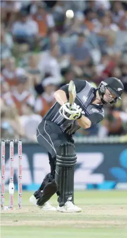  ?? — AFP ?? New Zealand’s Colin Munro bats during the Twenty20 Tri Series internatio­nal against England at Seddon Park in Hamilton.