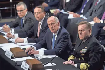  ?? SAUL LOEB, AFP/GETTY IMAGES ?? From left, Andrew McCabe, Rod Rosenstein, Dan Coats and Michael Rogers testify before the Senate intelligen­ce panel in June about Section 702 of the Foreign Intelligen­ce Surveillan­ce Act.