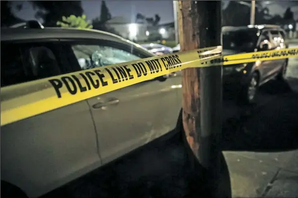  ?? MARK GRAVES/AP ?? Portland, Oregon, police respond to a shooting in a house in the 4000 block of Southeast Boise Street, on June 6. Homicide detectives also responded. A year after Portland’s police bureau underwent significan­t budget cuts – amid demands to defund the police – the city’s mayor announced on Wednesday, that he wants to add to the department’s budget in order to hire more officers and buy body cameras.