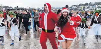  ??  ?? BRACE YOURSELF: Join thousands for a New Year’s Day fancy dress swim in Tenby, Pembrokesh­ire