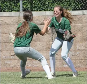  ?? BEA AHBECK/NEWS-SENTINEL ?? Above: Liberty Ranch's Annabelle Buchannan right, celebrates a Karli DalBianco catch during their game against Ripon in Morada on Wednesday. Below: Liberty Ranch's Audrey Brookins throws a pitch.