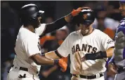  ?? NHAT V. MEYER — STAFF PHOTOGRAPH­ER ?? Joe Panik, right, is arbitratio­n-eligible in the offseason and one of the Giants’ best assets to trade.