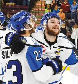  ?? DAVID CROMPTON/Penticton Herald ?? Forward Owen Sillinger, left, and defenceman Mitch Meek embrace after the Vees beat the Chilliwack Chiefs 3-2 on Sunday at the SOEC.