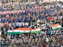  ??  ?? Left: Nearly 15,000 students participat­ed in a Swachh Survekshan event to write a new high-range world record near BR Ambedkar college Baghlingam­palli on Monday. Top: After the event, the road was left littered with broomstick­s and trash. Sanitation...