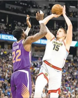  ?? David Zalubowski Associated Press ?? THE LAKERS could let Nikola Jokic, right, just be a scorer and live with it “if he ends up with 40 points if he only has four assists,” one front-office executive says.