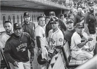  ?? Steve Gonzales / Staff photograph­er ?? The Astros give the Bregman stare after third baseman Alex Bregman (center, holding batting helmet) homered in the eighth inning of a victory over AL West rival Oakland on Aug. 27.