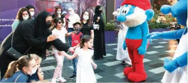  ?? Kamal Kassim / Gulf Today ?? ↑ The children are excited to see the cartoon characters at City Walk Dubai during Dubai Summer Surprises.
