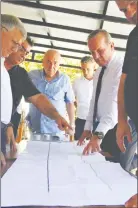 ?? ?? Mr Ataoğlu and others look at plans for the cable car project