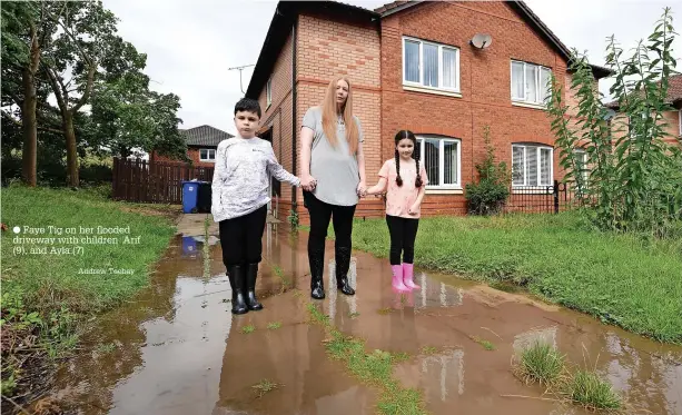  ?? Andrew Teebay ?? ● Faye Tig on her flooded driveway with children Arif (9), and Ayla (7)
