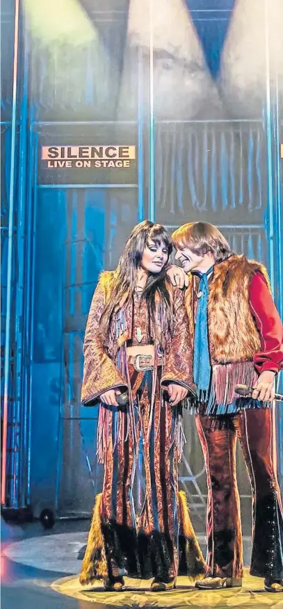  ?? ?? Before a big performanc­e, Cher (Debbie Kurup), at the
back of the stage, looks to
her younger Sonny & Cherera self (Millie
O’Connell) for inspiratio­n in this scene
from The Cher Show