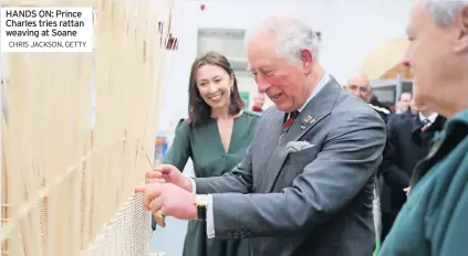  ?? CHRIS JACKSON, GETTY ?? HANDS ON: Prince Charles tries rattan weaving at Soane