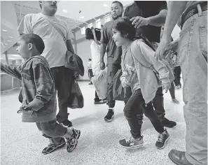  ?? ERIC GAY/AP ?? Asylum seekers from Honduras and Guatemala arrive at a bus station June 21 after they were processed and released in McAllen, Texas.