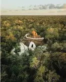  ?? ?? Rock art … SFER IK appears above the forest canopy. Photograph: Azulik