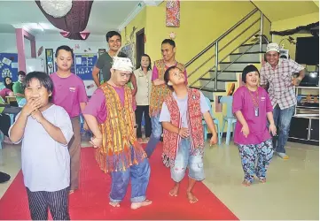  ??  ?? PDK Kapit trainees showcase their talent by performing the ‘ngajat’ during the party.