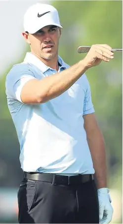  ?? Picture: Getty. ?? Brooks Koepka points the way to another birdie during yesterday’s round.
