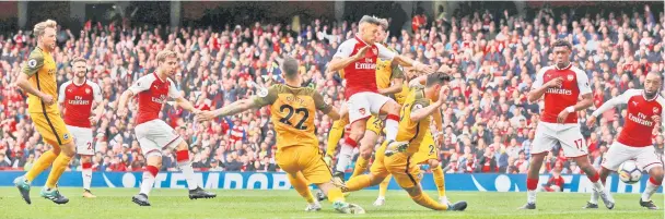  ??  ?? Arsenal’s Spanish defender Nacho Monreal (third left) scores the team’s first goal during the English Premier League football match between Arsenal and Brighton at the Emirates Stadium in London. — Reuters photo