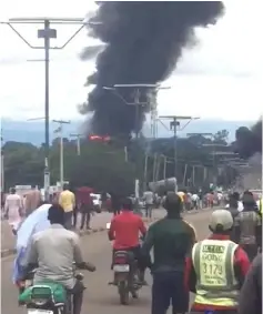  ??  ?? A smoke and fire are seen during a gas explosion in Lafia, Nigeria, in this image obtained from social media. — Reuters photo