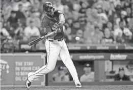  ?? ERIK WILLIAMS/USA TODAY SPORTS ?? Astros first baseman Jose Abreu connects on a home run against the Twins on June 1 in Houston.