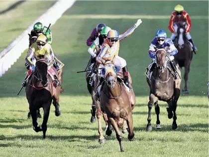  ?? Picture / Nick Reed ?? Opie Bosson aboard Melody Belle takes out January’s Karaka Million.