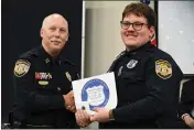  ?? MEMPHIS POLICE DEPARTMENT VIA AP ?? Preston Hemphill receives a certificat­e from Memphis Assistant Chief of Police Don Crowe after completing the training to join the department's Crisis Interventi­on Team on July 21, 2022. Police officials said Monday that Hemphill and another officer were relieved of duty in connection with the death of Tyre Nichols.