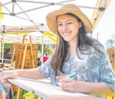  ?? ?? USQ postgradua­te student Johanna Park works in the Japanese Gardens.