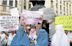  ?? —REUTERS ?? SAYING NO People demonstrat­e in support of Afghan women and children in Barcelona, Spain, on Aug. 17. One placard reads: ‘Neither the veil nor the burqa is clothing or culture. They are feminicida­l weapons.’