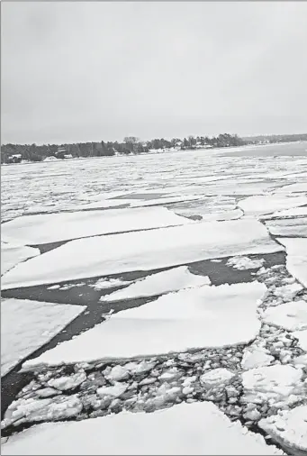  ??  ?? Passenger Marcie Gephart rides on a ferry from Madeline Island to Bayfield, Wisconsin, in January.