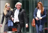  ?? (Arkansas Democrat-Gazette/Staci Vandagriff) ?? Blake Hendrix (center) and Annie Depper (right), Gilbert Baker’s attorneys, leave the federal courthouse in Little Rock with paralegal Jordan Fowler after the jury acquitted Baker on one count of bribery and could not reach a consensus on the other counts Thursday.