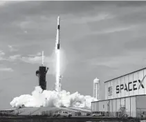  ?? JOE BURBANK/ORLANDO SENTINEL ?? The SpaceX Falcon 9 rocket carrying astronauts Doug Hurley and Bob Behnken lifts off from Kennedy Space Center on May 30.