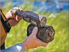  ?? MORGAN TIMMS/Taos News ?? Dozens of glass bottles and an old oil canister were among the items collected by the team of locals Sunday (June 14) in Pilar.