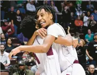  ?? JESSICA HILL/SPECIAL TO THE COURANT ?? Innovation’s Amari Cruz, right, celebrates with teammate Marlin Franco, left, at the end of Sunday’s Division IV boys basketball final against Cheney Tech at Mohegan Sun in Uncasville. Innovation won, 55-48.