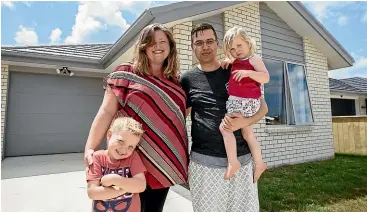  ??  ?? Natasha King and Matt van der Haast, with Jamie and Emily outside their Pukekohe home. The couple say home ownership has given them stability and allowed them to put down roots in the neighbourh­ood.