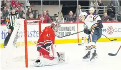  ?? USA TODAY SPORTS ?? The Oilers’ Josh Archibald, right, scores the game-winning goal against Carolina on Sunday.